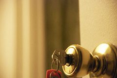 closeup image of key in doorknob
