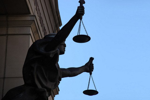 silhouette of Lady Justice holding scales